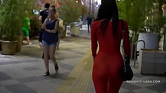 Bare-Breasted Woman In A See-Through Dress In A Public Place